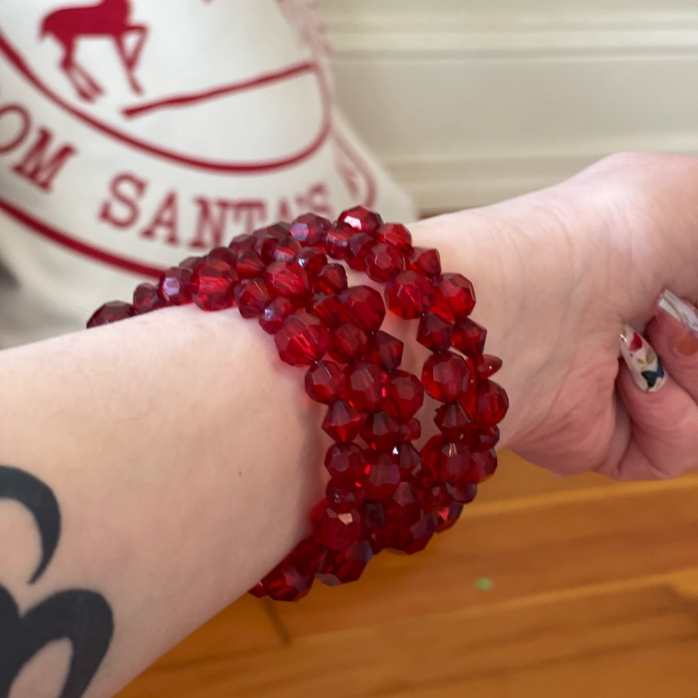 Gorgeous dangling adjustable red bracelet. Perfect for a Christmas evening